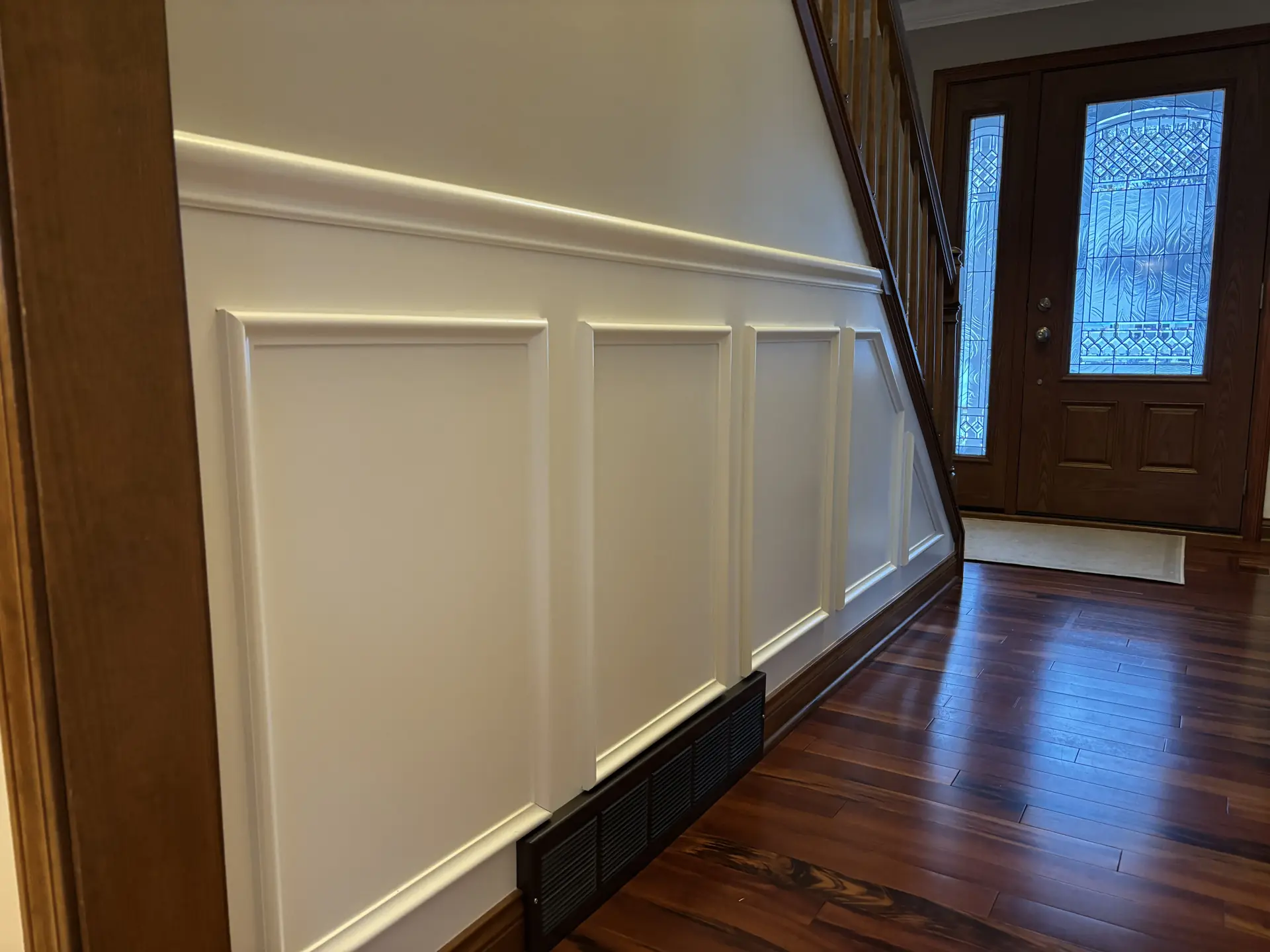 Wainscoting panels along staircase
